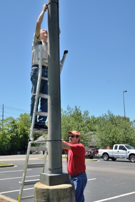 Mike Newman and Gene Summers erect one of four antennas Saturday morning. (6/24/17)